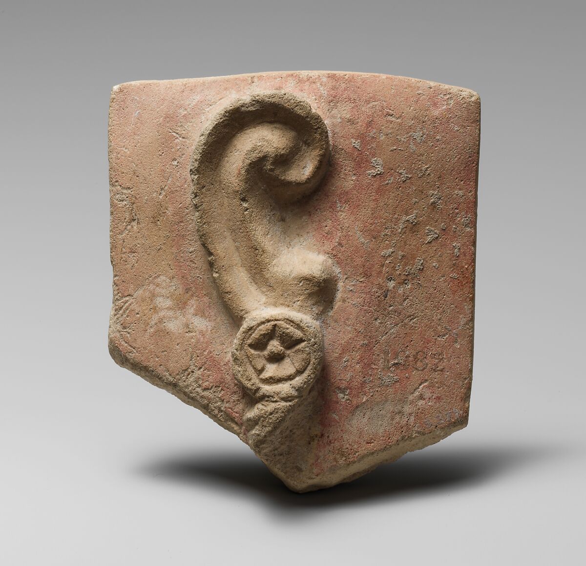 Stone votive relief of an ear with earring Cypriot Late Classical