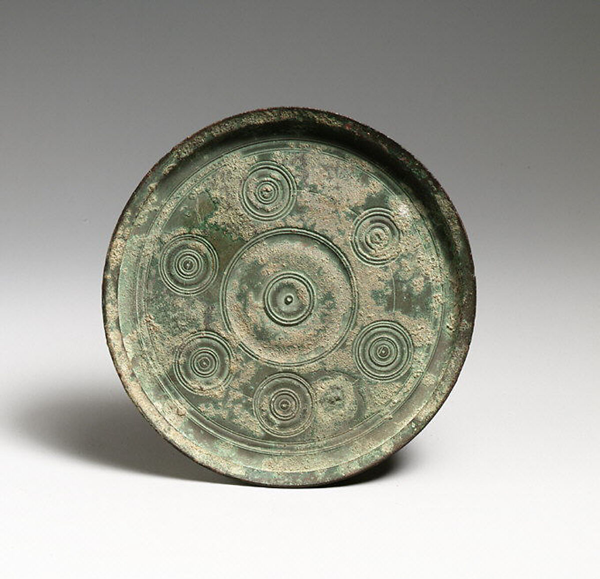 Bronze mirror Greek or Roman Late Hellenistic or Early Imperial The Metropolitan Museum of Art