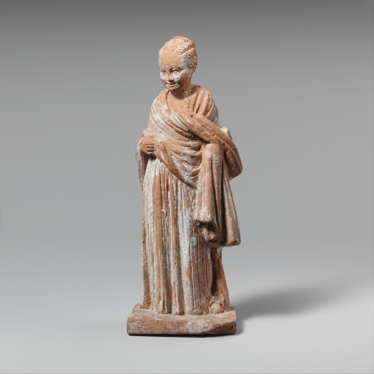 Terracotta statuette of a standing girl Greek, Attic Hellenistic The Metropolitan Museum