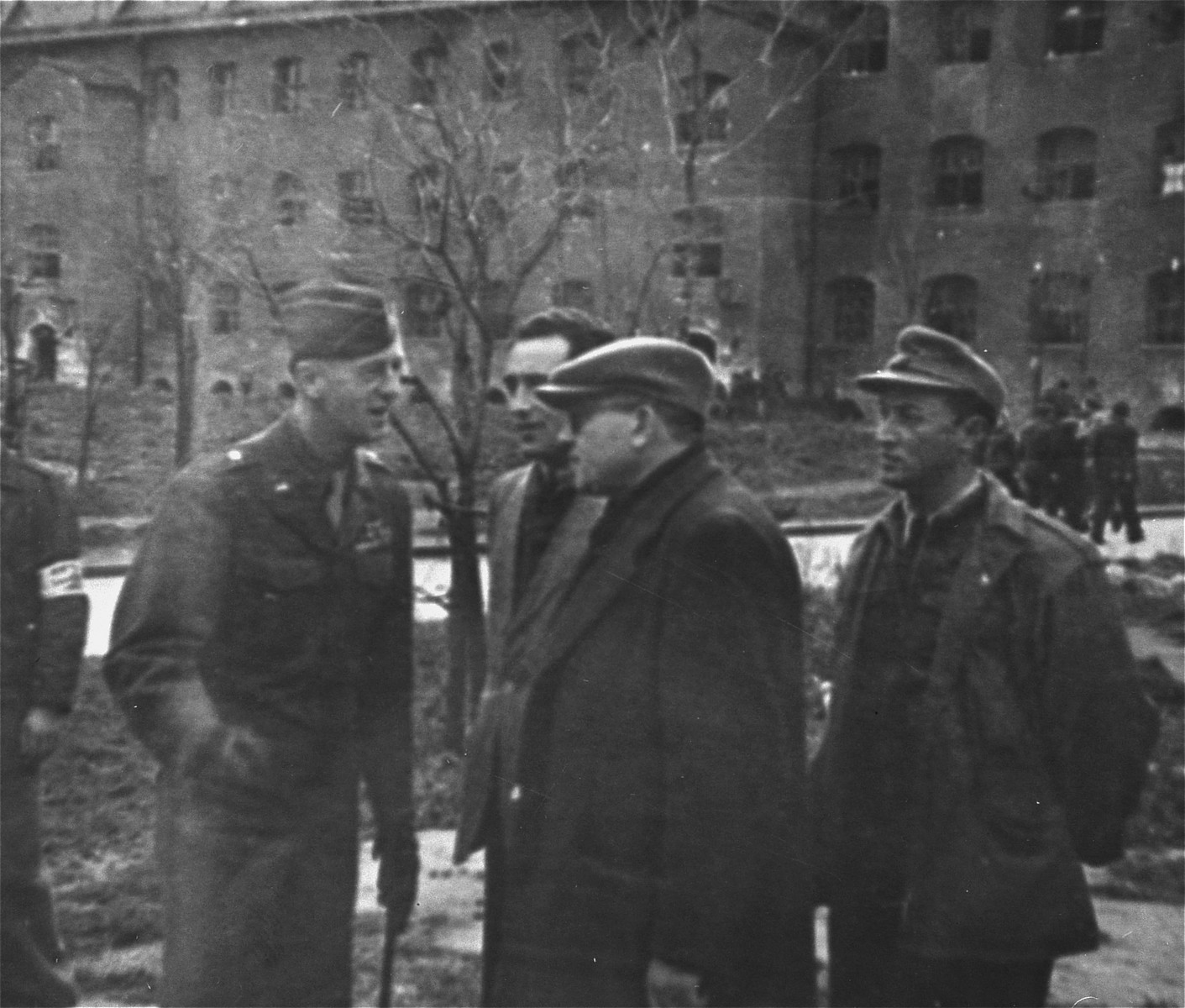 General Onslow S. Rolfe (left) and Dr. Samuel Gringaus (center) speak
