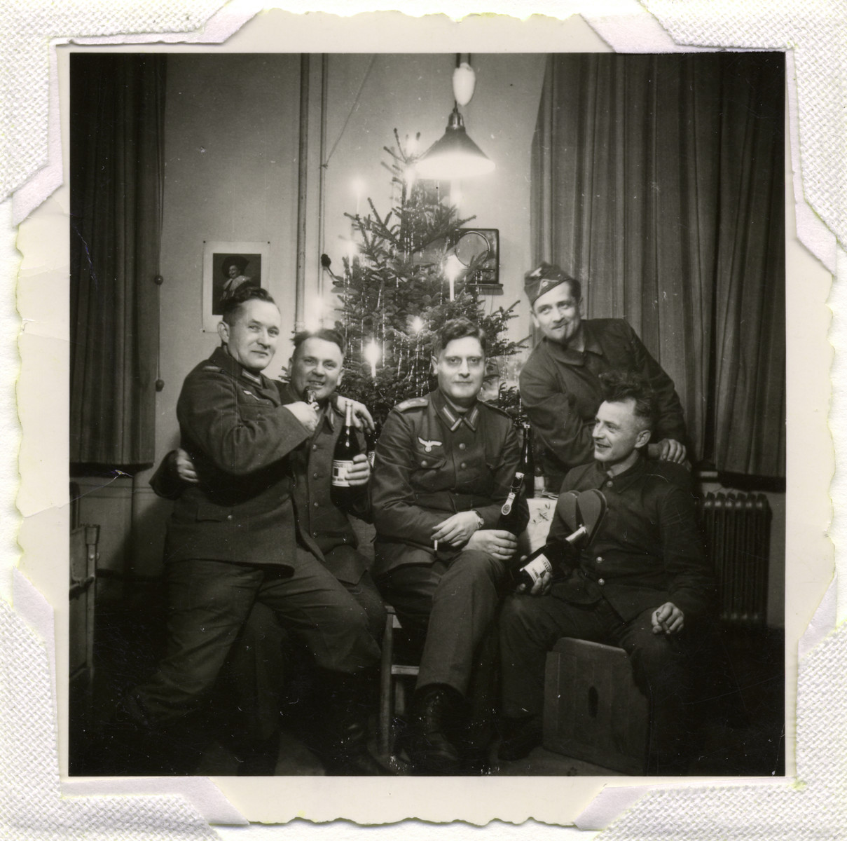 German soldiers pose in front of a Christmas tree. Collections Search