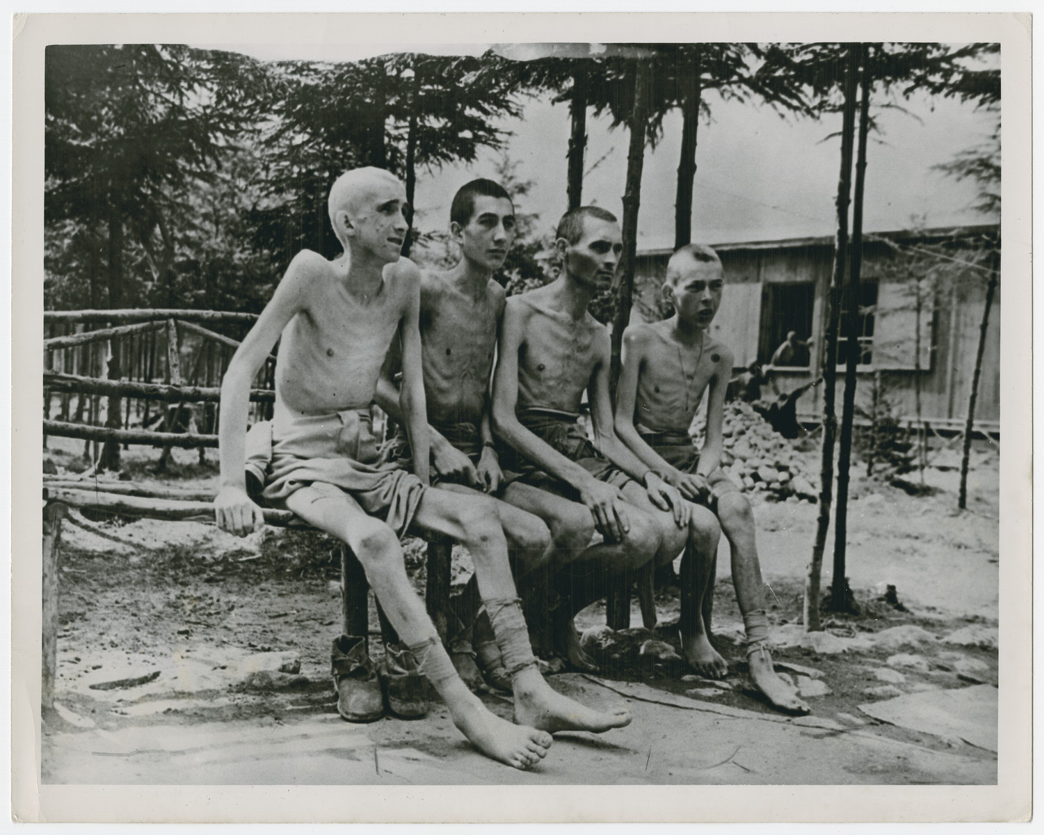 Group portrait of emaciated survivors of the Ebensee concentration camp