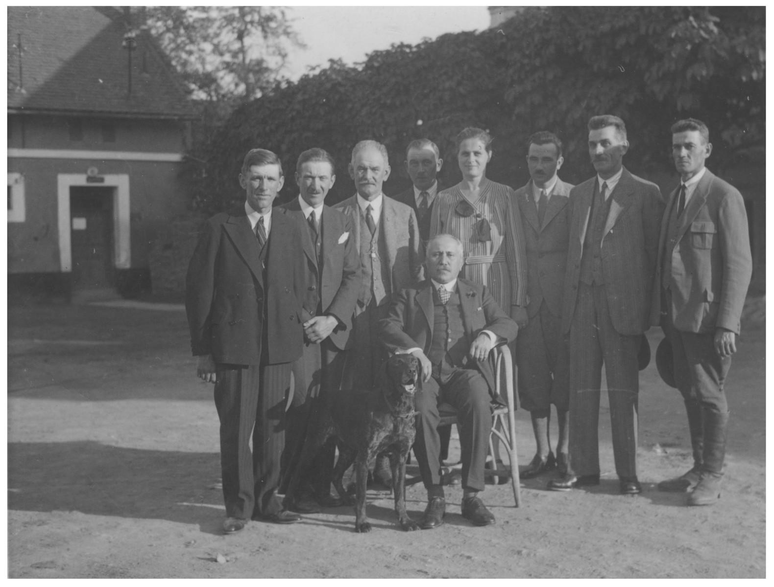 Julius Kraus poses with the employees of his farm. Collections Search