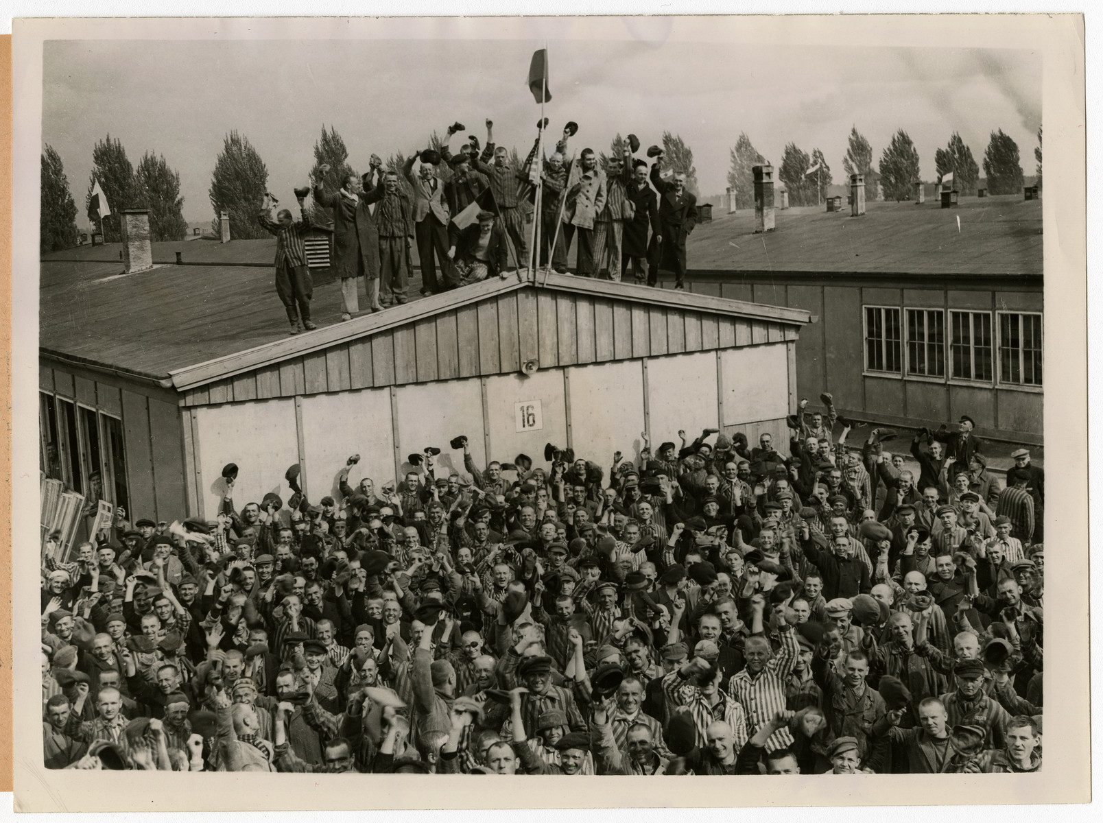 View of Dachau concentration camp prisoners cheering on their