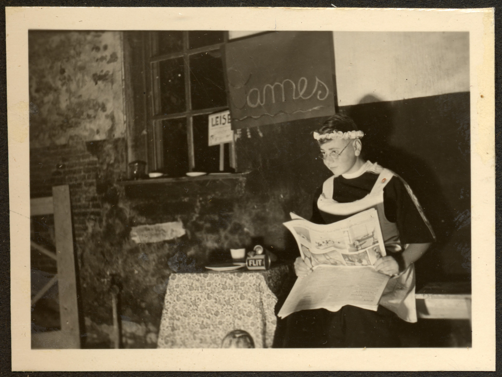 A young boy, perhaps a GermanJewish refugee, performes in a play at a