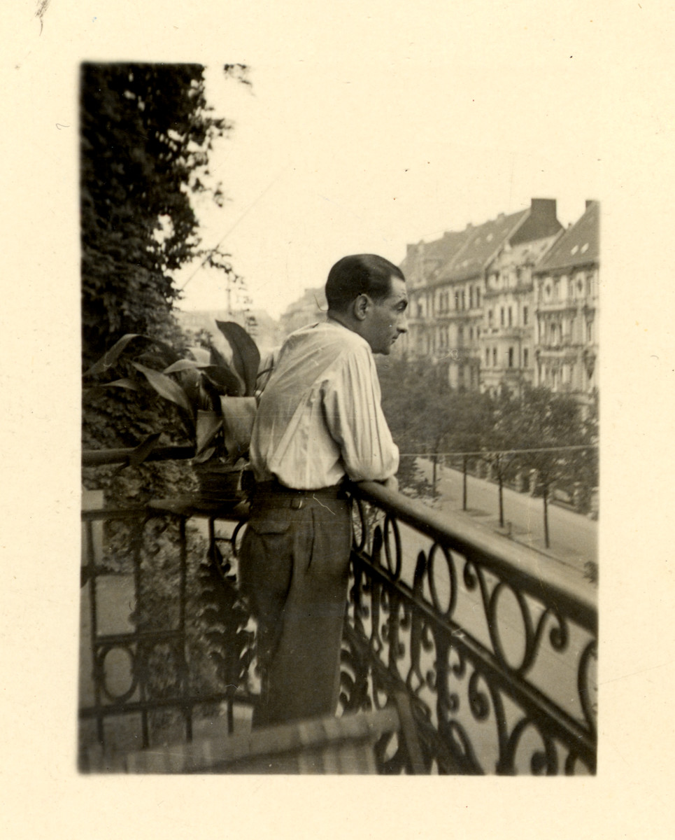 Berthold Marx looks out the balcony of his apartment in Berlin