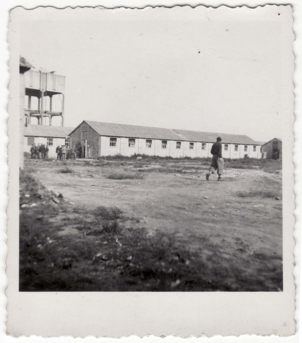 A Jewish refugee walks on the grounds of the Kitchener refugee camp