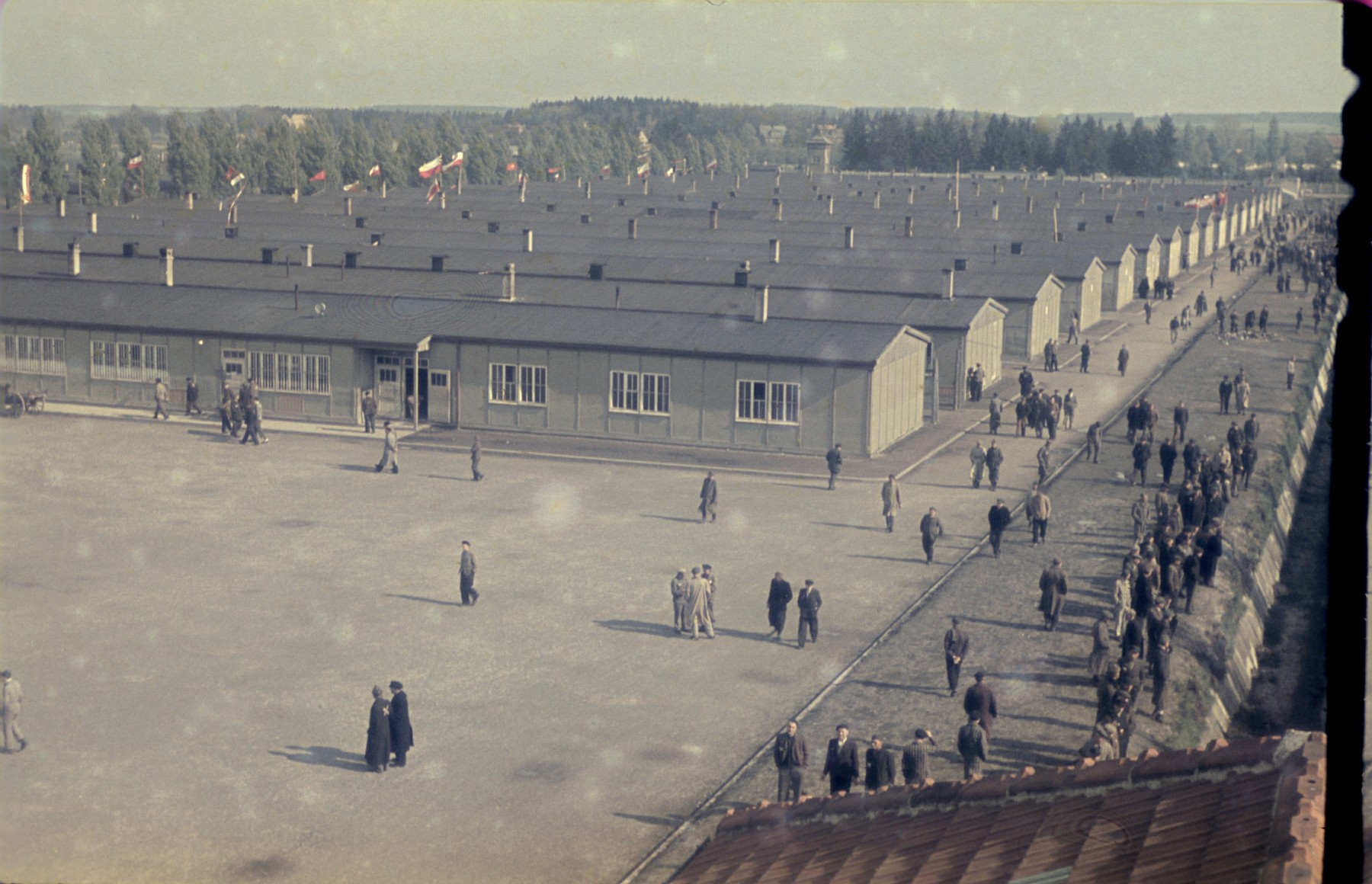 View from above of former prisoners walking along the main street