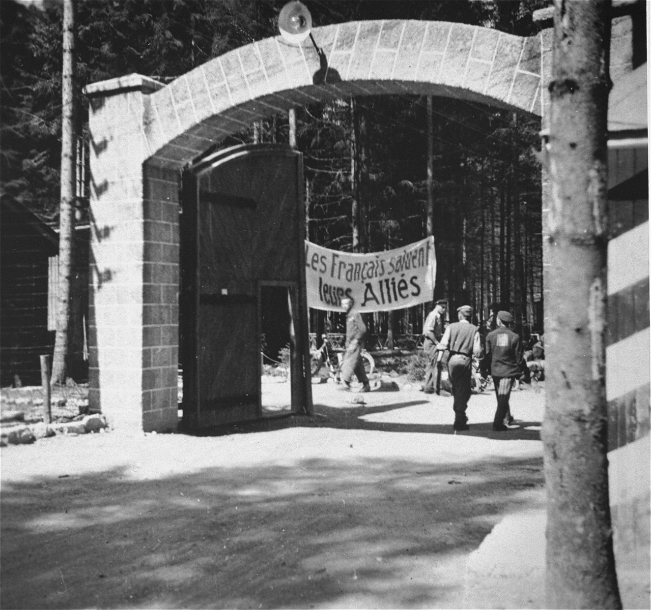 View of the main gate at the Ebensee concentration camp. The sign just