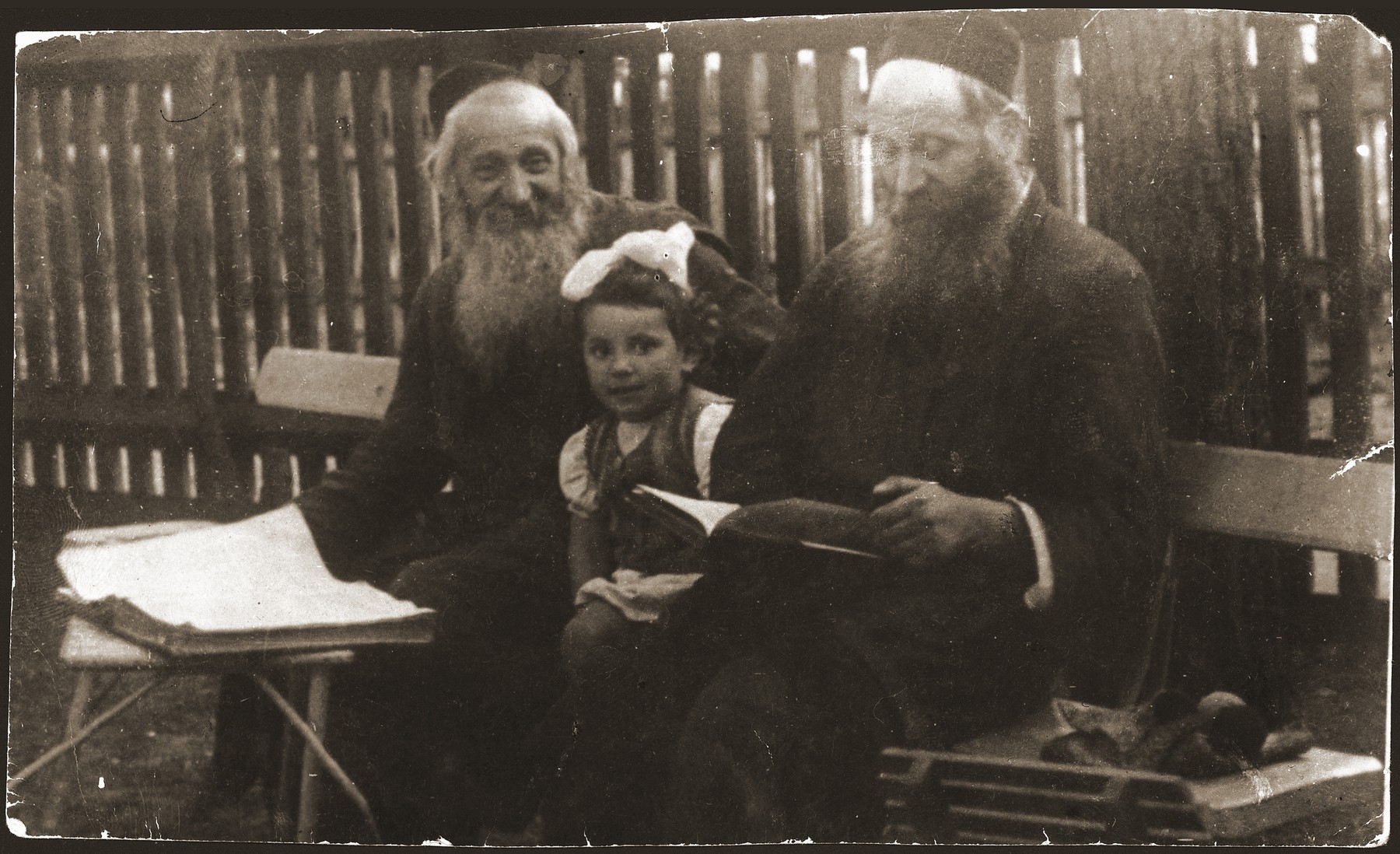 Two kosher slaughterers in Otwock study a page of the Talmud together