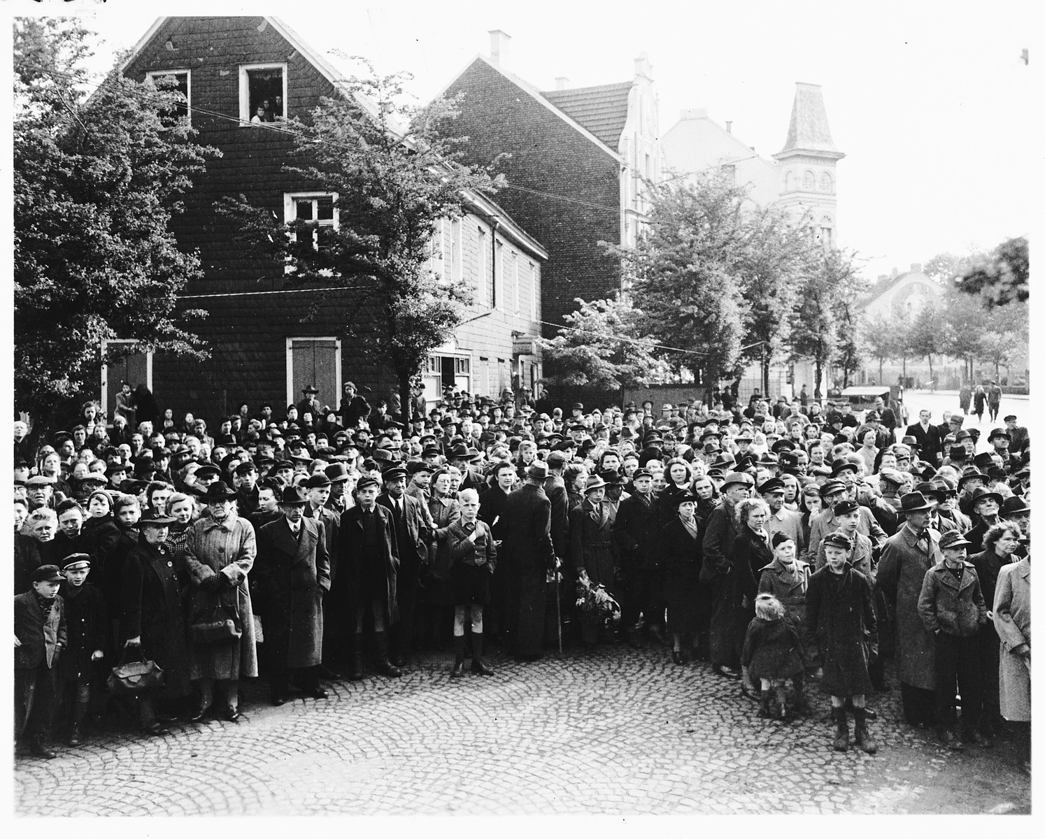 German civilians attend funeral services for the 71 political prisoners