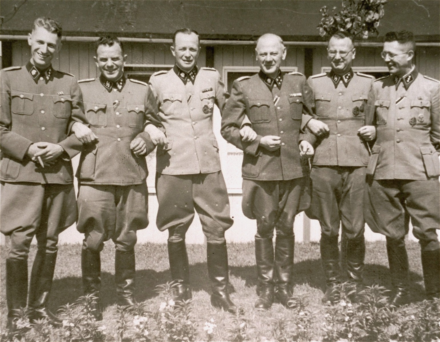 Commandant Franz Ziereis poses with members of the SS staff of the