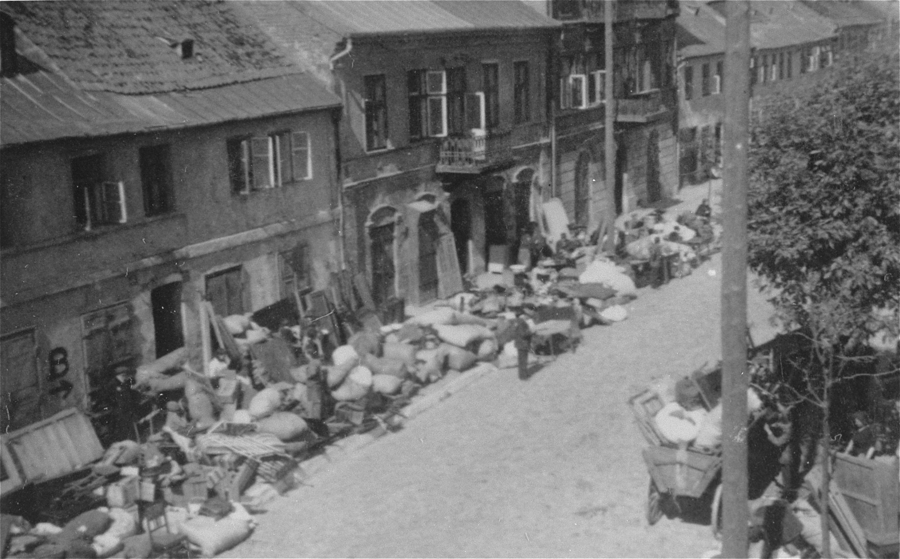 Piles of furniture and household belongings of Jews who are being transferred to the ghetto