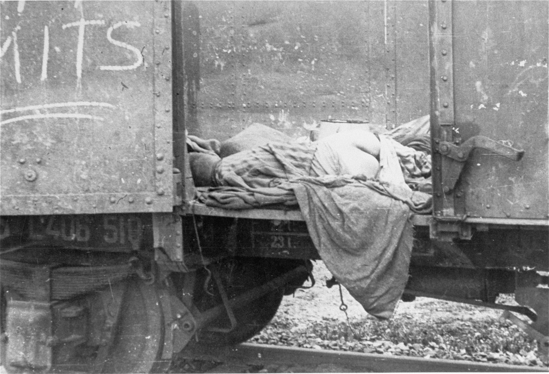 Corpses lie in one of the open railcars of the Dachau death train