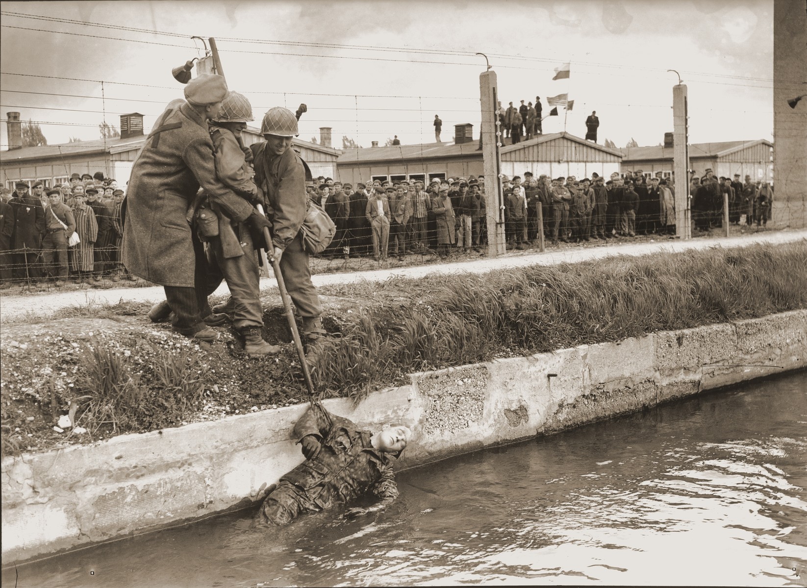 Two soldiers from the 42nd Rainbow Division and a liberated prisoner