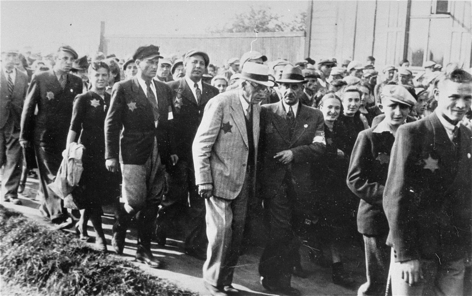 Mordechai Chaim Rumkowski, chairman of the Jewish Council (center