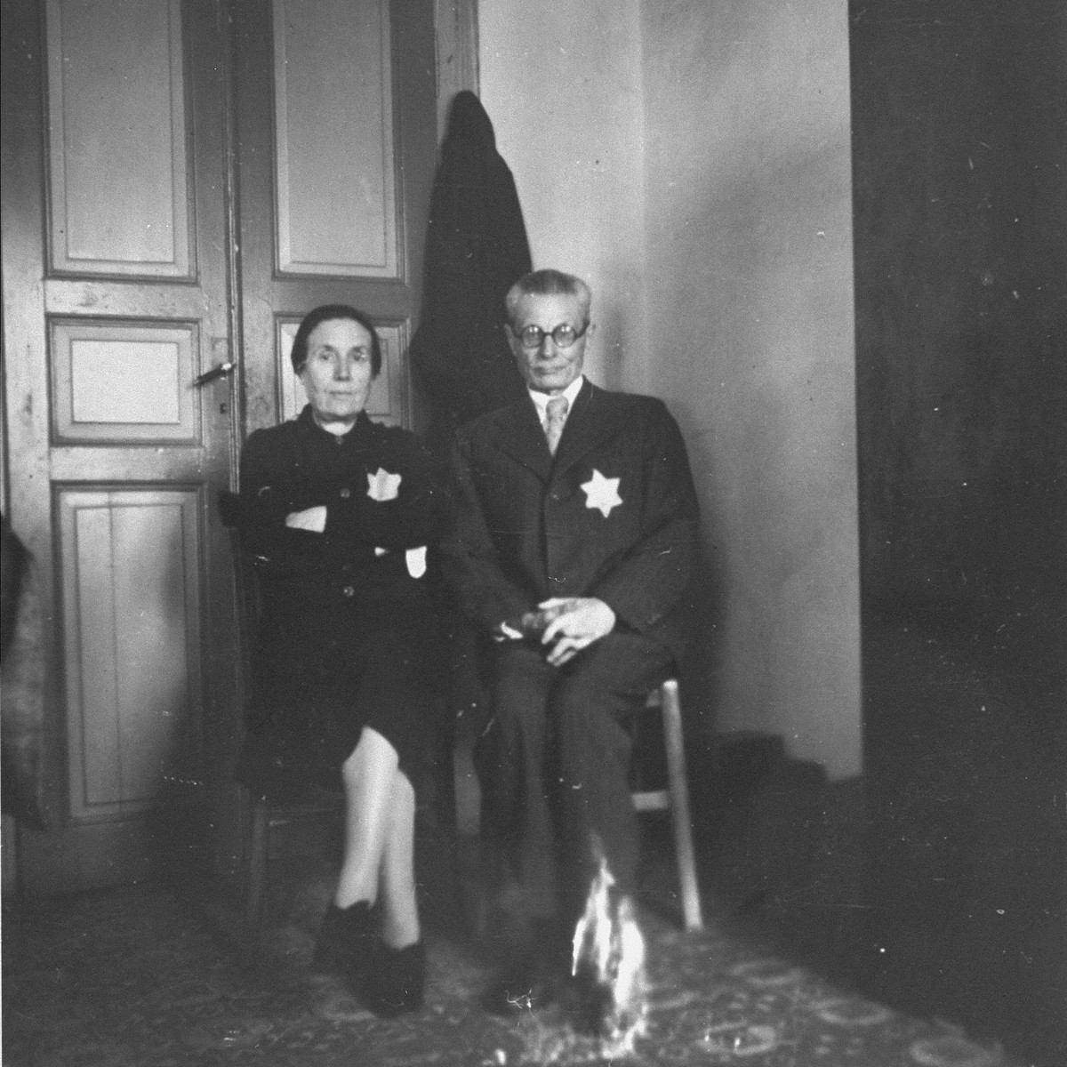 A Jewish couple wearing the yellow star poses in their