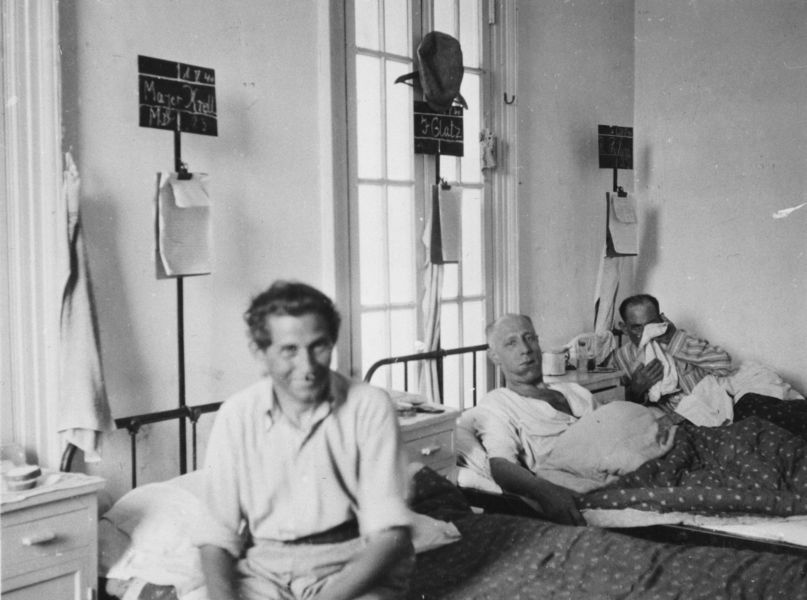 Patients sit and lie in their beds in the Shanghai Jewish hospital