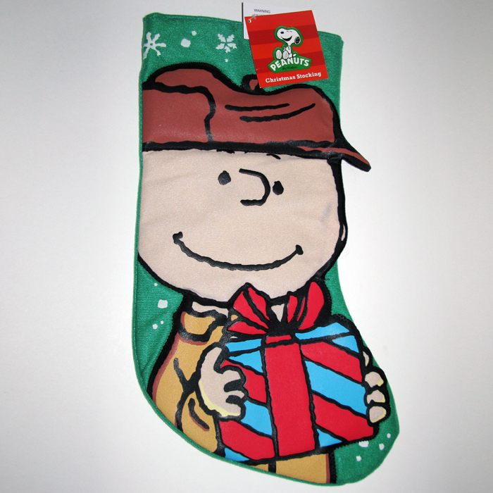 Charlie Brown holding gift Christmas Stocking