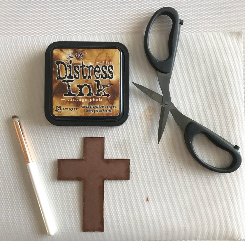 Photo of the back layer of the cross for todayโs Two Very Different Easter Cards Post showing the distressing process with scissors and Vintage Photo Distress Ink.