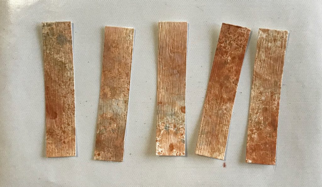 Photo of the cut pieces from the Honey Bee Stamps Barn Wood Plank die set used in today's Happy Spring Butterfly Card post.