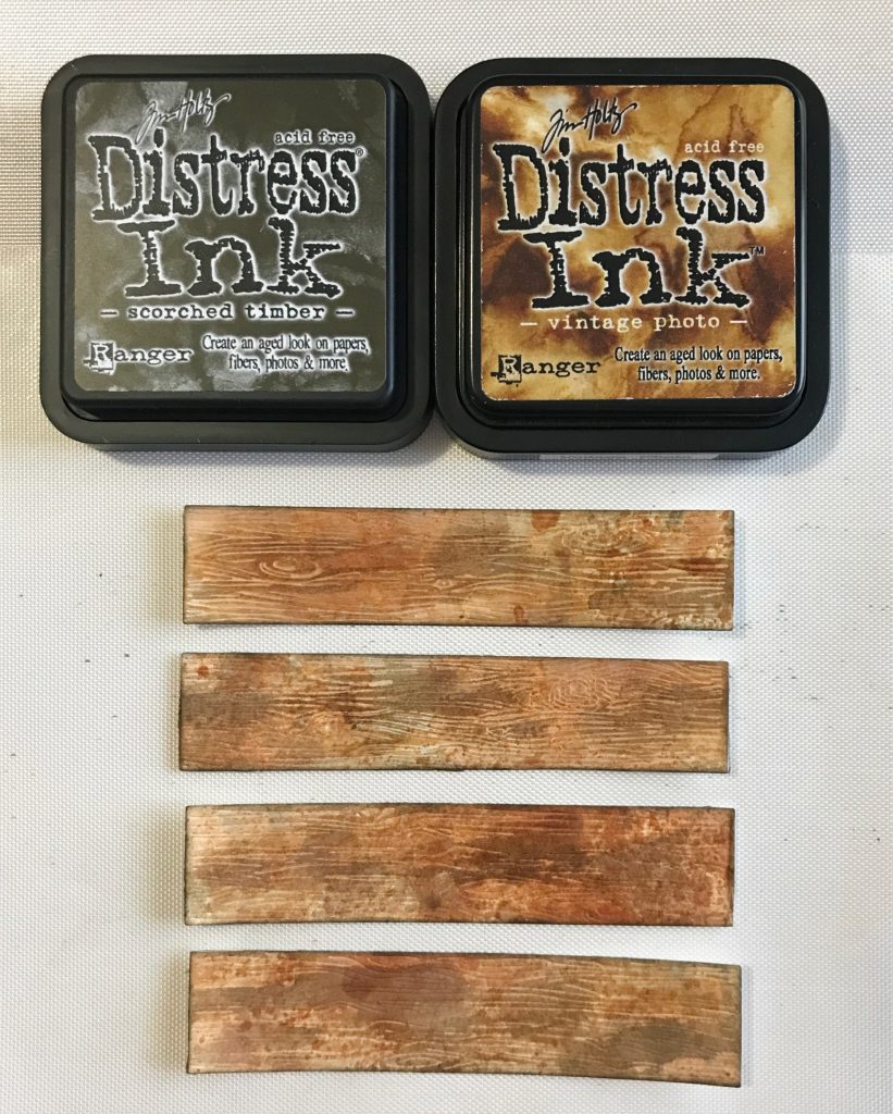 Photo showing the Distress Inks usded to add extra color and depth to the Honey Bee Stamps Barn Wood Planks die cuts.