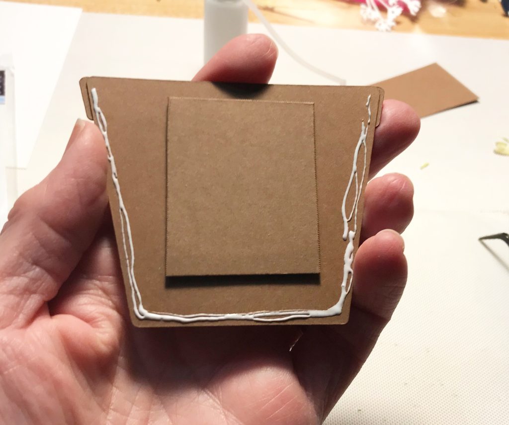 Photo showing where the majority of the glue was placed to glue it down to the card front.