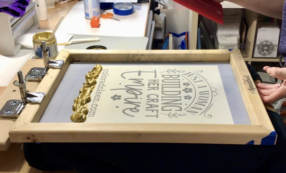 Photo of the screen ready to be printed with Speedball Opaque Gold Fabric Ink with my DIY screen printing press.