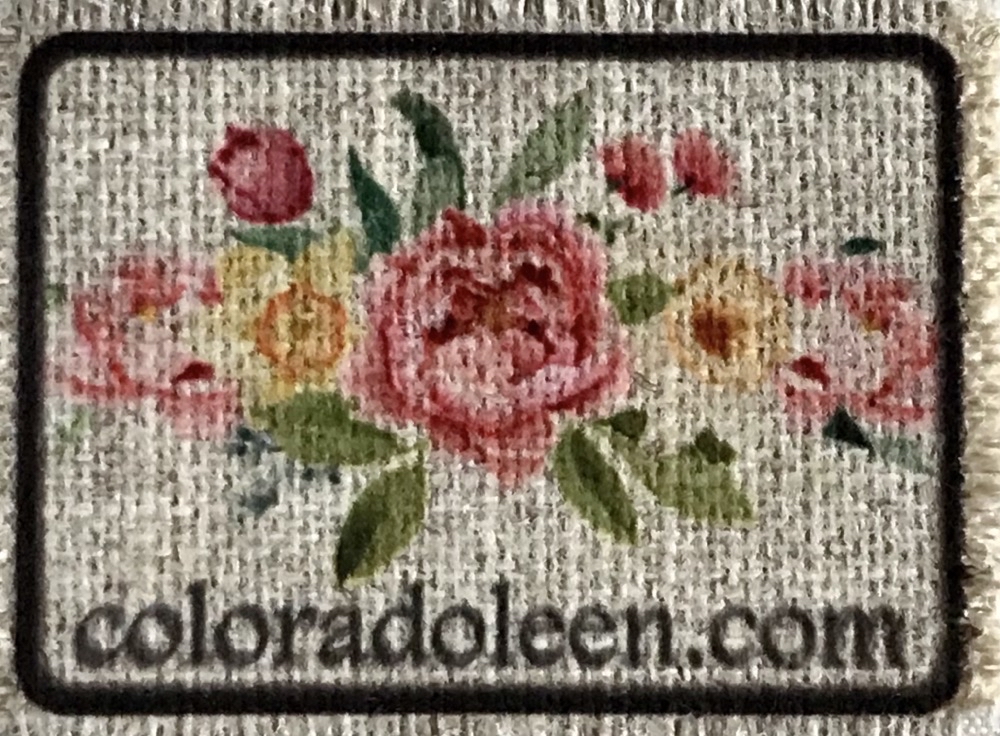 Photo showing a sublimated floral image on the smooth side of the Kokomo Linen Outdoor fabric used in today's How to Sublimate Hat Patches post.