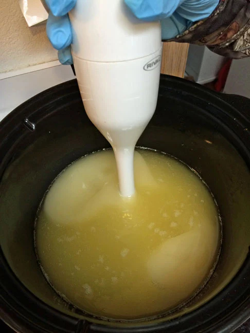 Photo showing the beginning of the emulsification of the lye and oils with the stick blender for today's Flashback Friday Let's Make Soap post.