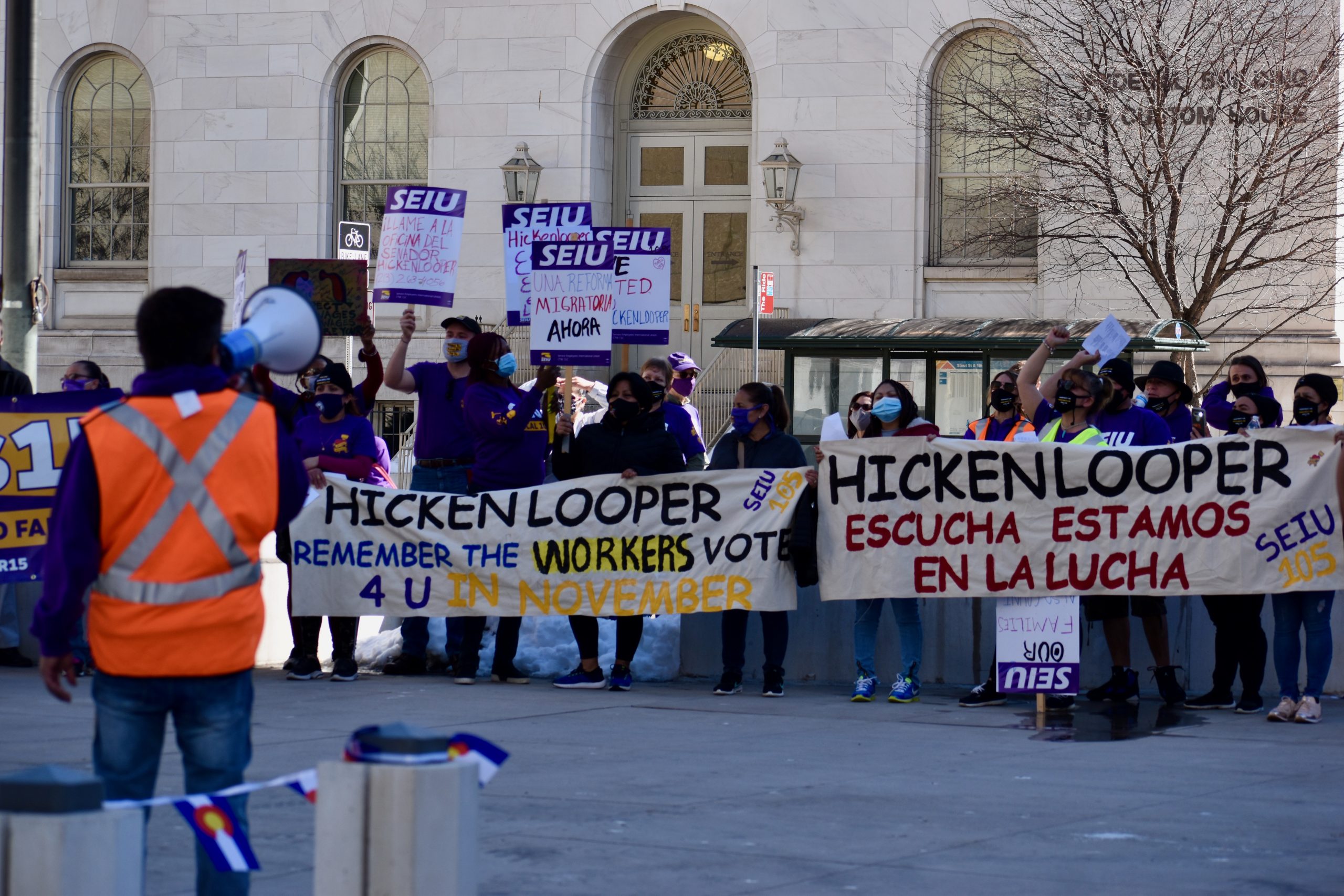 Unions rally outside Sen. Hickenlooper’s office, demand minimum wage