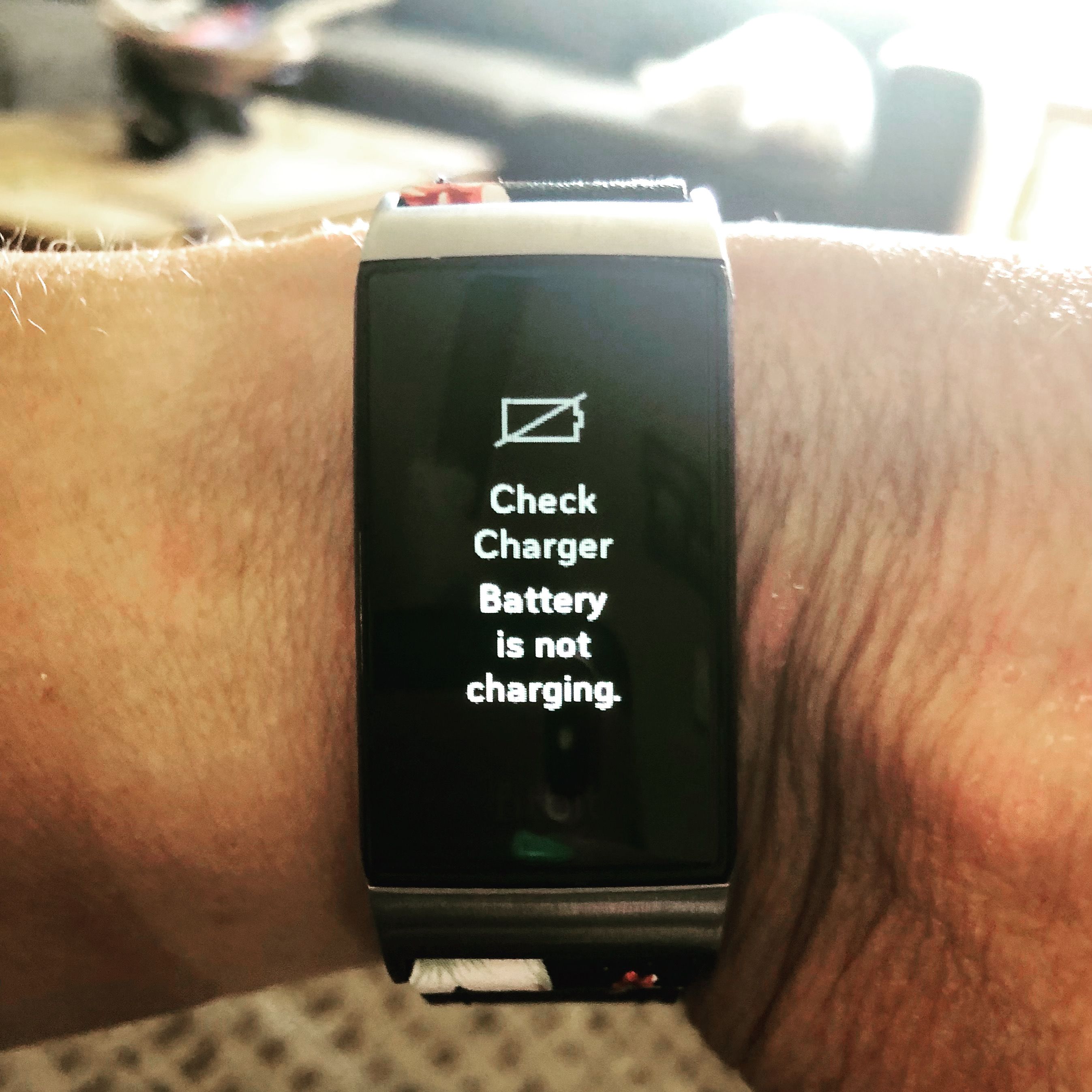 Solved: Charge 4 says battery not charging - Fitbit Community