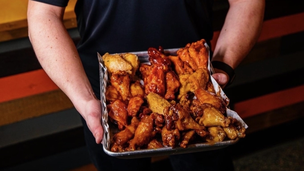 Wing Snob serving chicken wings, cheesecake in west Frisco Community