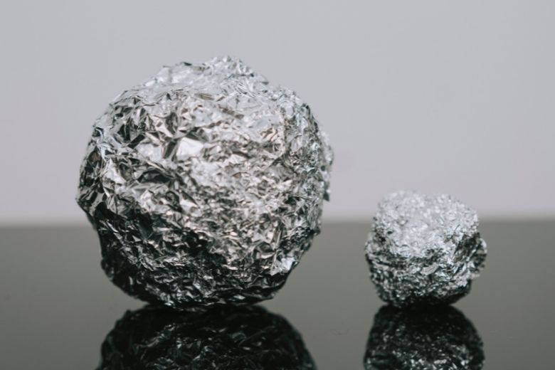 Here’s why you should put a ball of aluminum foil in your dishwasher