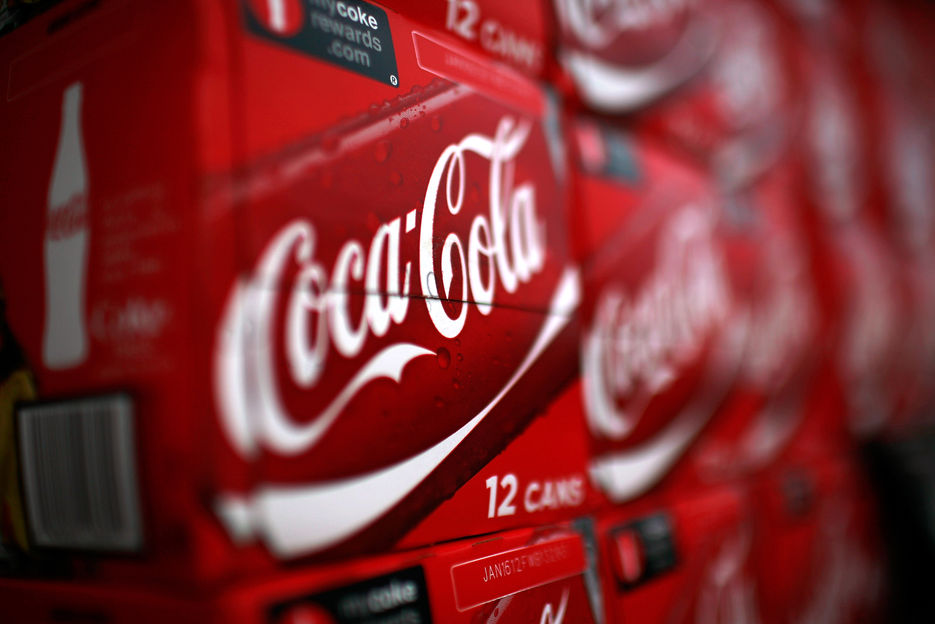 Coke expands its costcutting program as earnings slide Fortune