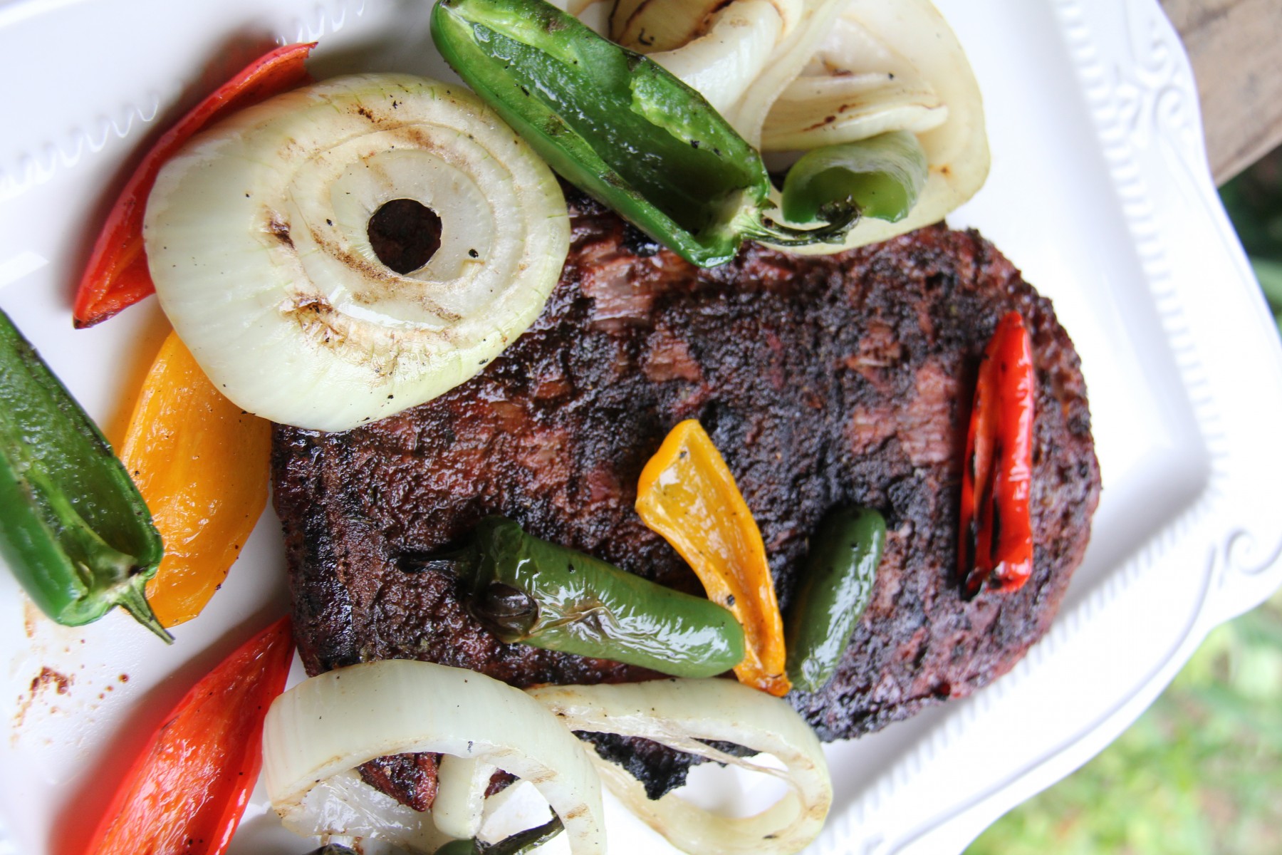 BBQspiceRubbed Skirt Steak with Charred Onions and Jalepenos