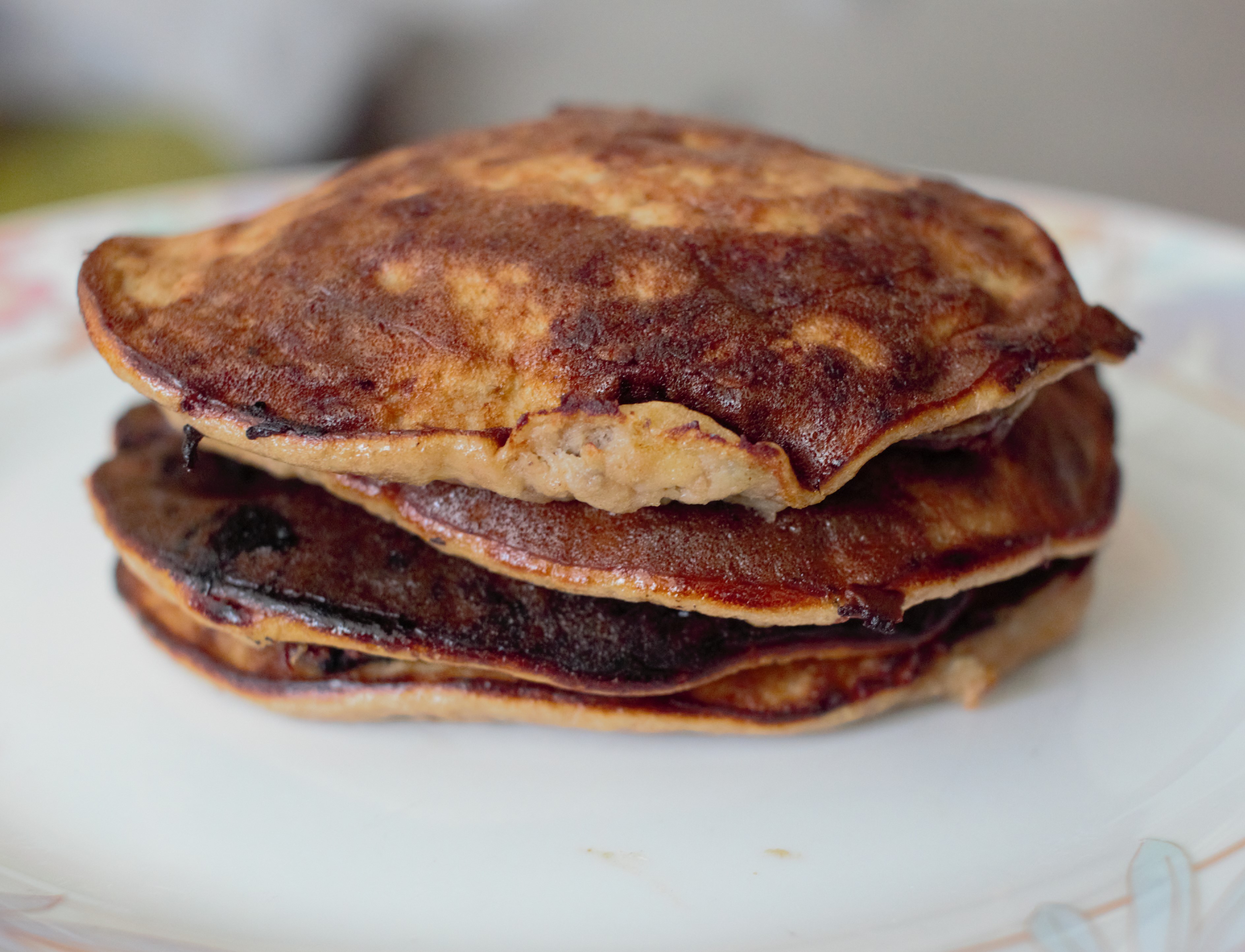 Dark Chocolate Chip Banana Protein Pancakes Eating with Cookie