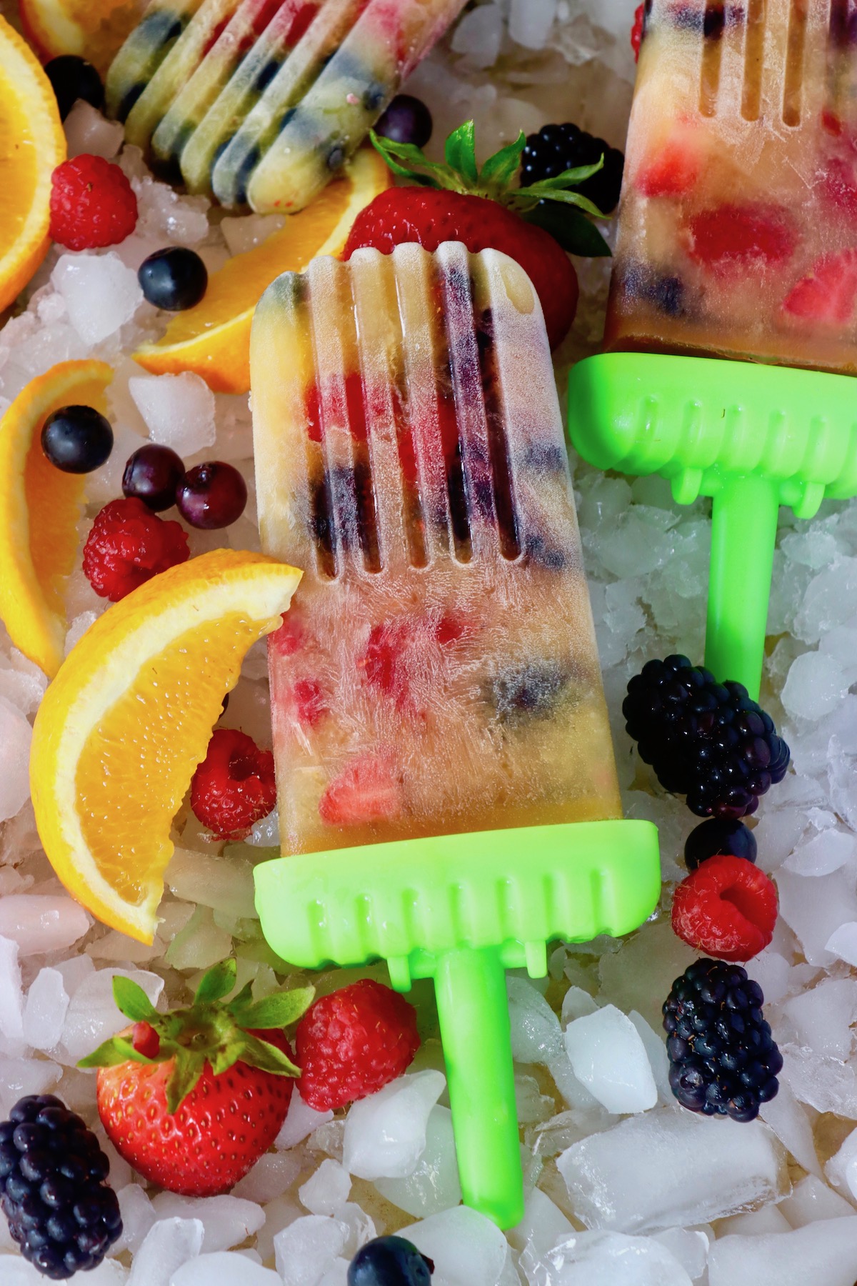 Orange Popsicles with Berries Cooking On The Weekends