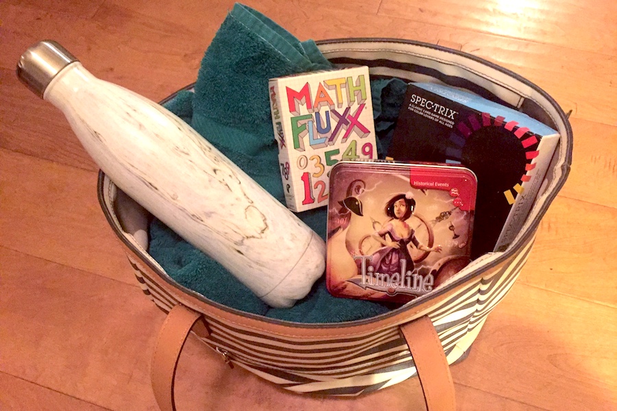 5 fun family board games for travel this summer, because they're small!