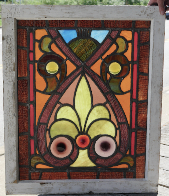 Antique stained glass window with hand blown roundels.