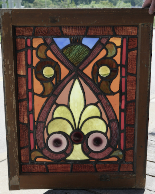 Antique stained glass window with hand blown roundels.