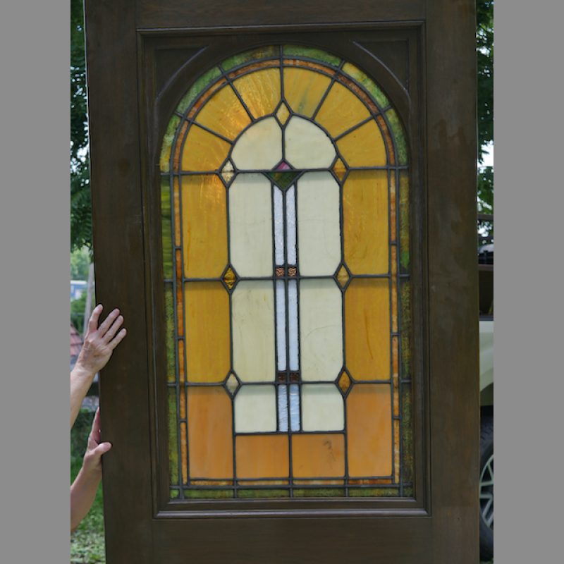 Antique oak door with leaded stained glass.