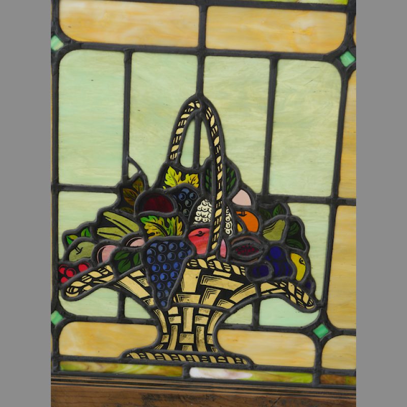Antique stained glass window with hand painted fruit basket