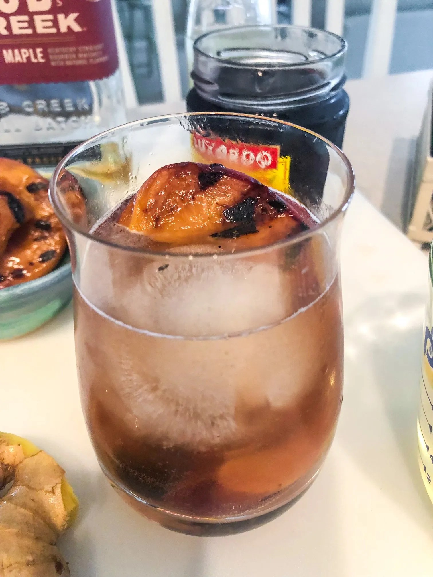 Smoked Maple Whiskey with Ginger Beer, Ginger Simple Syrup, Grilled Peaches and Maraschino