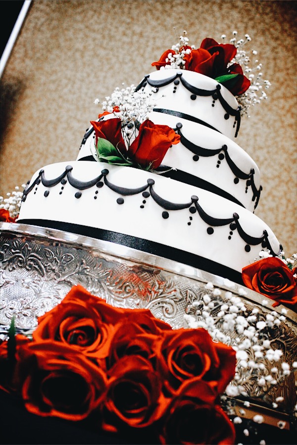 romantic black and white glam wedding cake with red