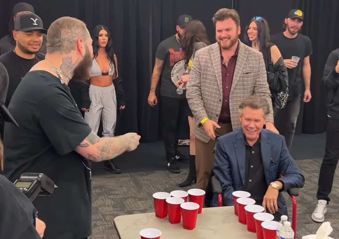 WATCH Randy Travis Proves He's A Beer Pong Legend Alongside Post