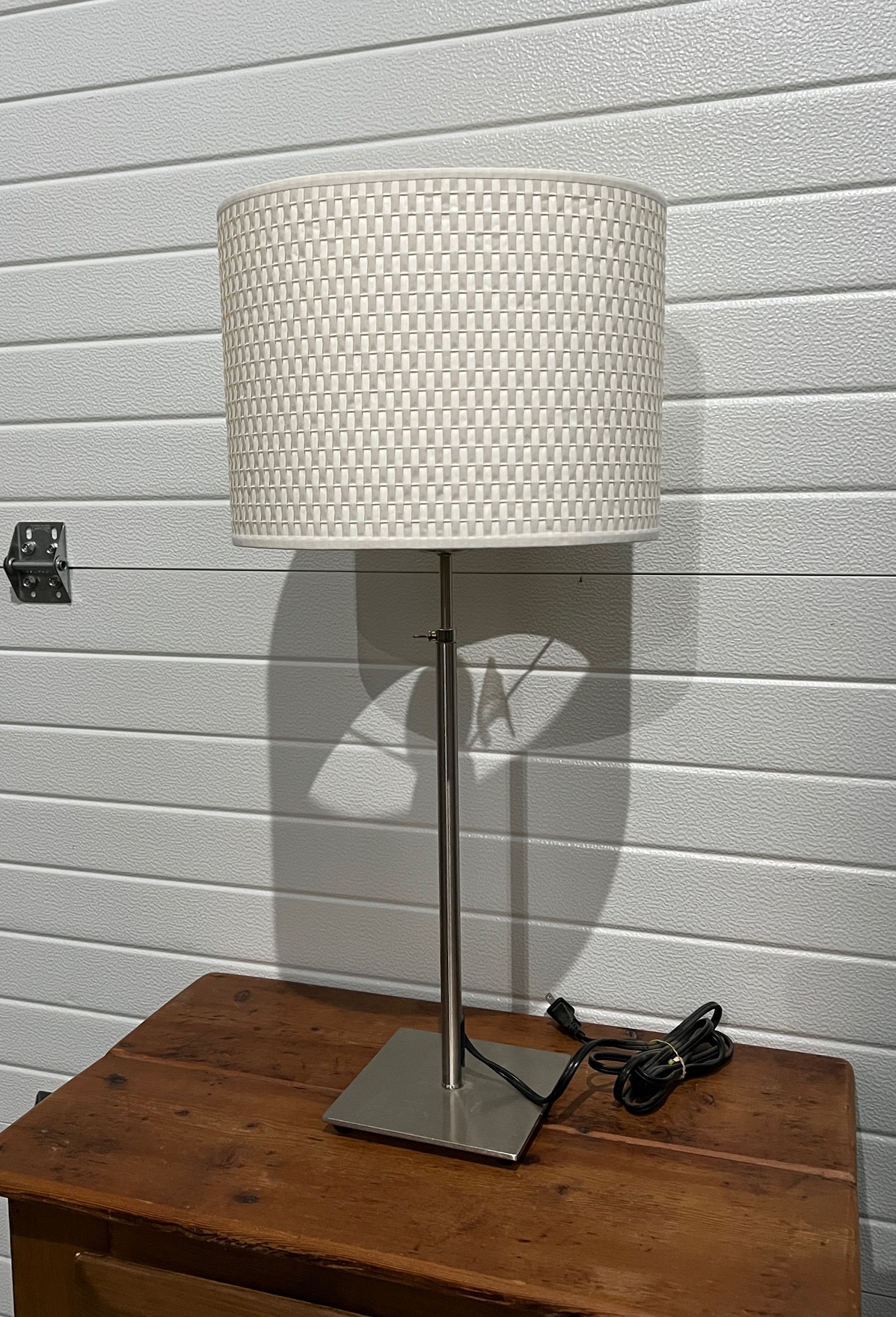 Modern Silver Table Lamp with Oval CreamColored Wicker Shade