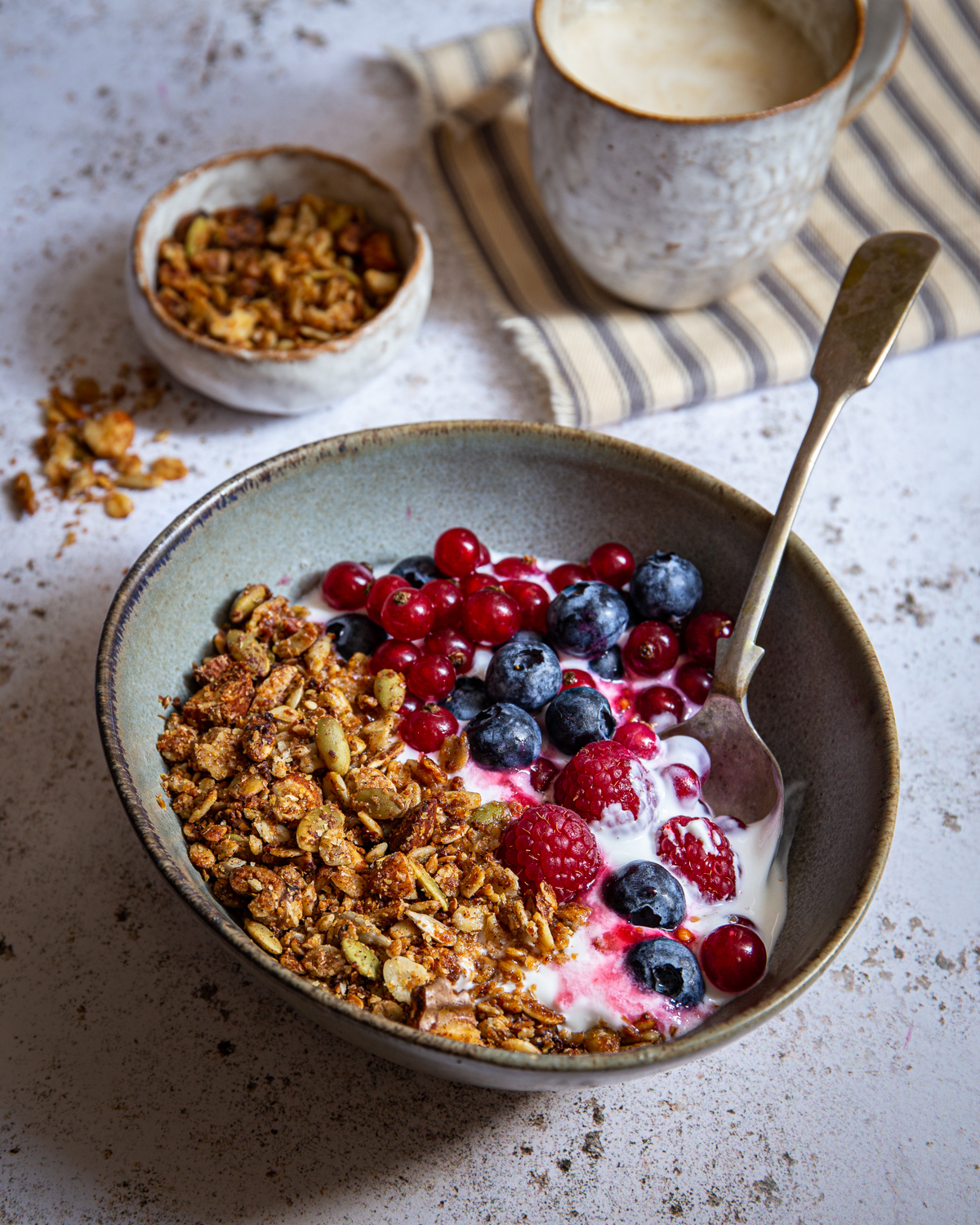 Homemade oat & wheat germ granola with goat’s yogurt and berries
