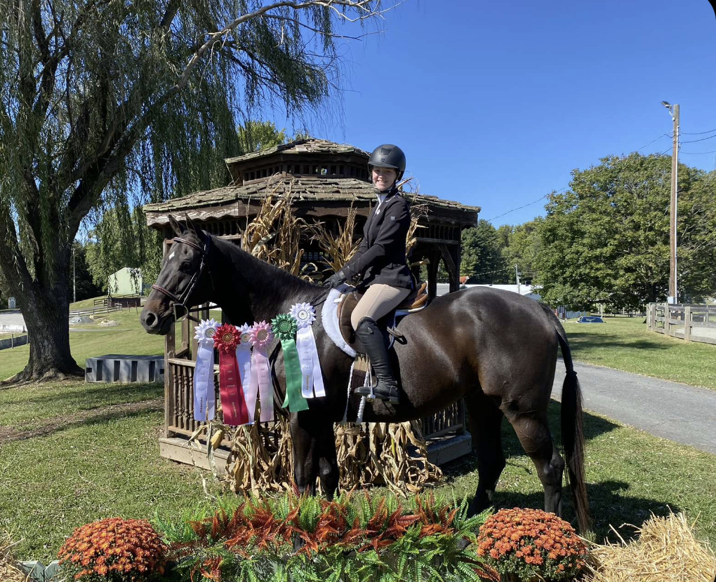 Trotting to triumph in horseback riding; Weisman shares equestrian