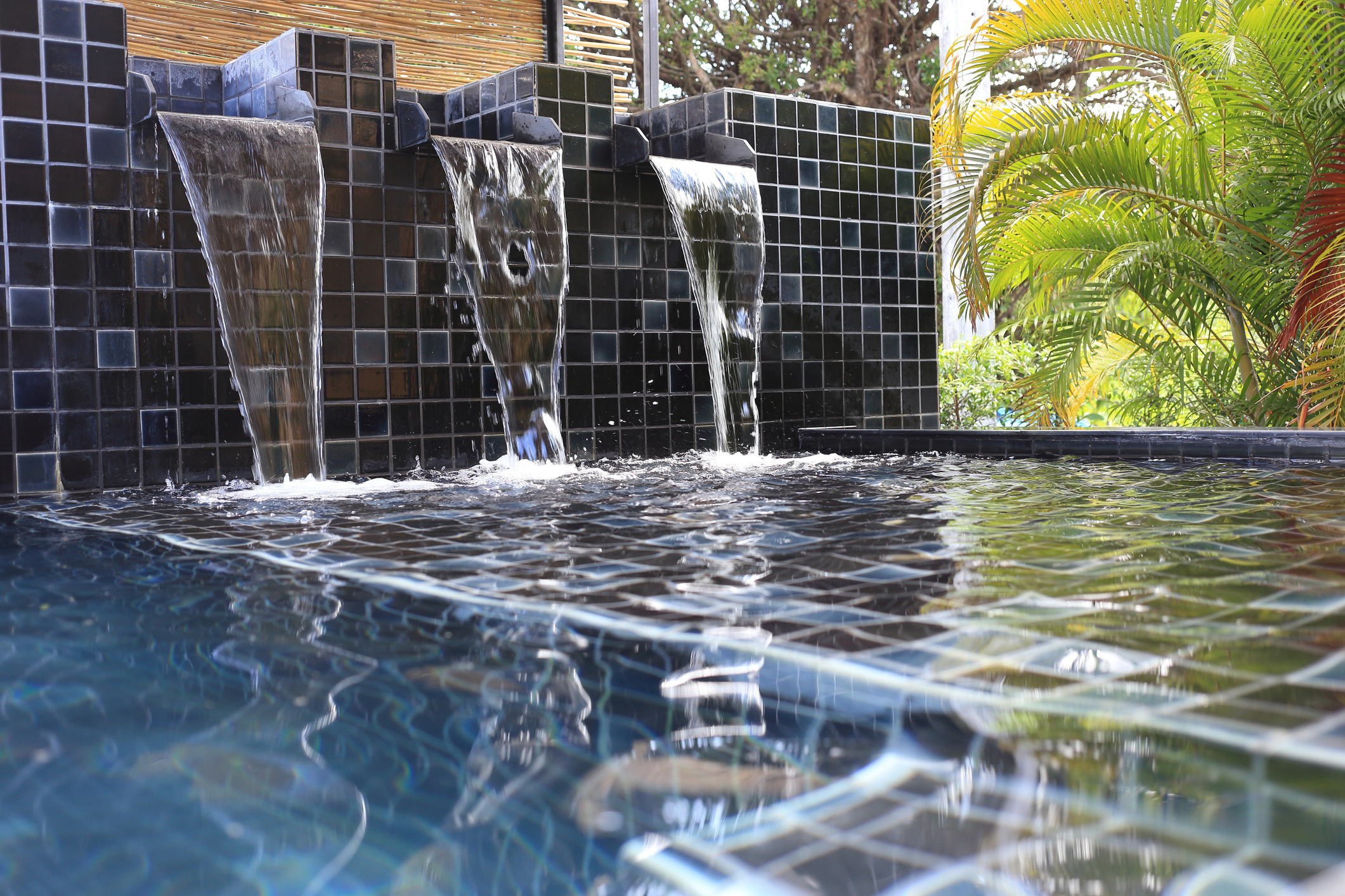 flowing water decorated in swimming pool Creative Tile & Hardwood Floors